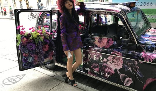 posing with the taxi